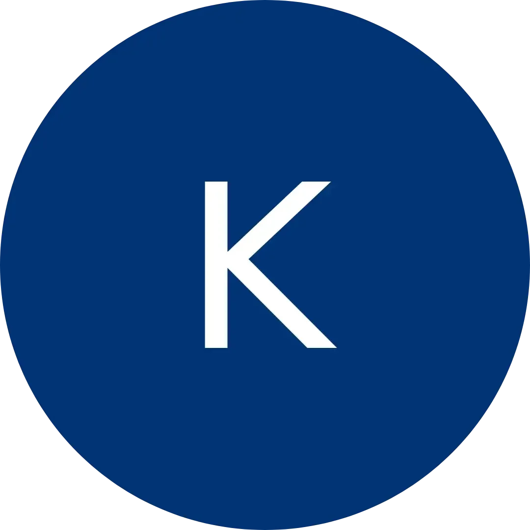 White letter K centered within a dark blue circular icon.