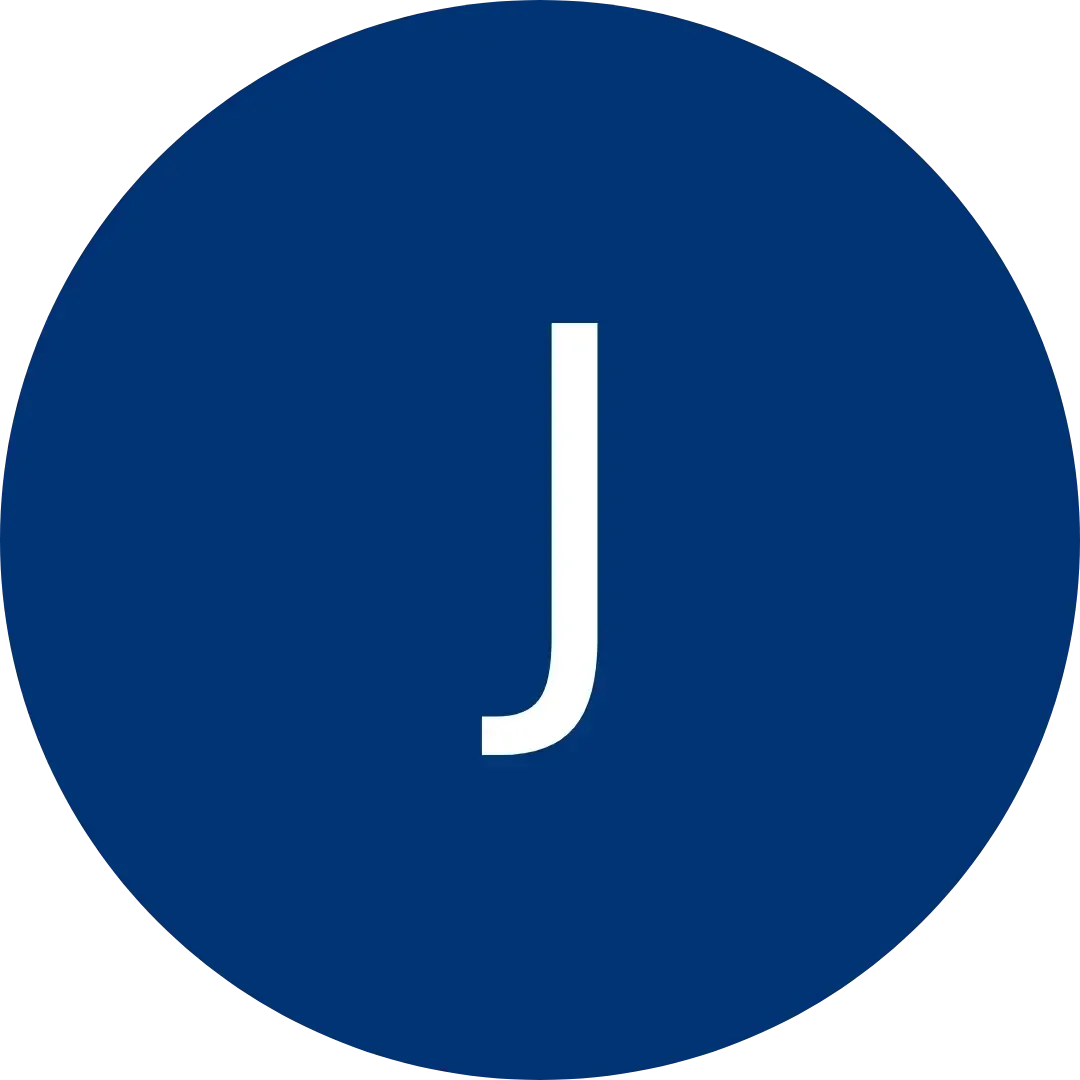 White letter J centered in a dark blue circular background.